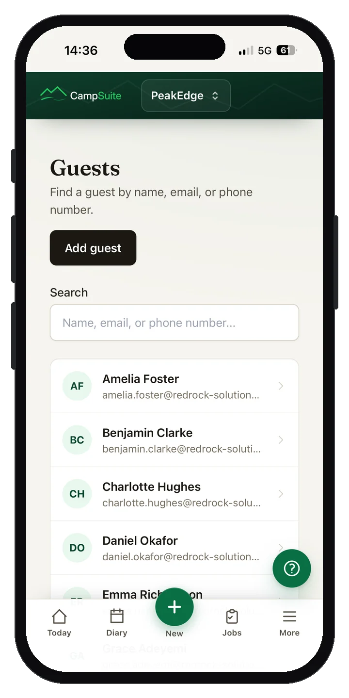 The CampSuite guest list on a phone with names, emails and phone numbers